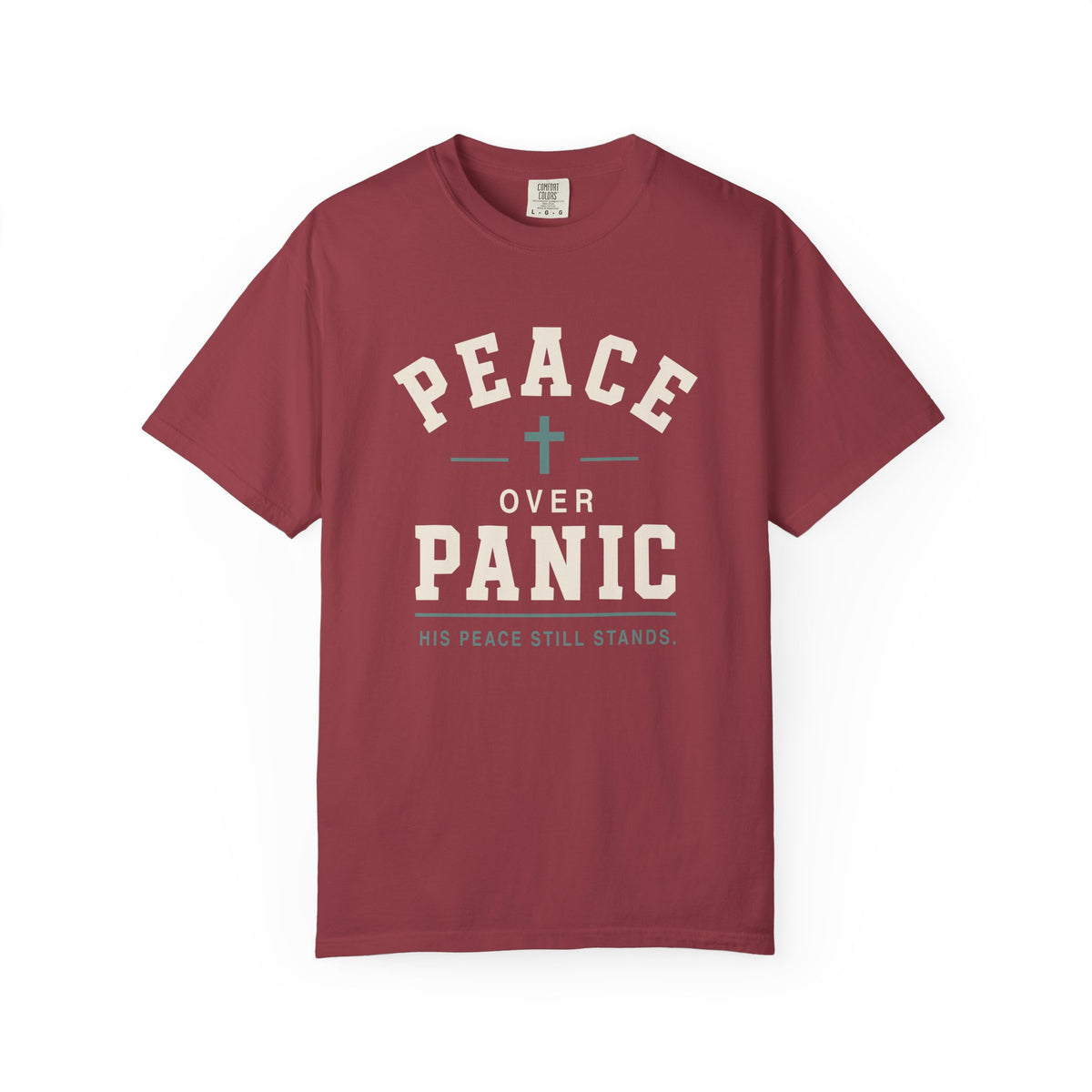 Maroon Christian T-shirt featuring a “Peace Over Panic—His Peace Still Stands” design with a cross on a plain white background.