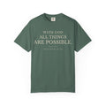 Front view of blue spruce Christian T-shirt featuring With God All Things Are Possible and Matthew 19:26.