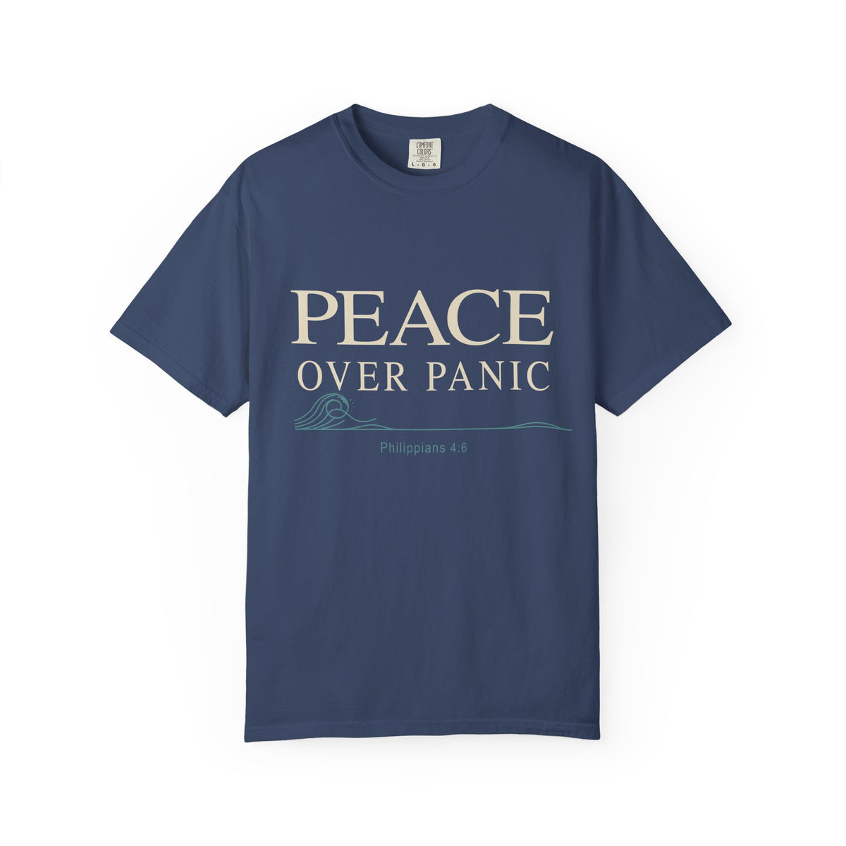 Light blue Christian T-shirt featuring a “Peace Over Panic” design with a wave and Philippians 4:6 on a plain white background.