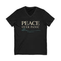Black V-neck Christian T-shirt featuring a “Peace Over Panic” design with a wave and Philippians 4:6 on a plain white background.