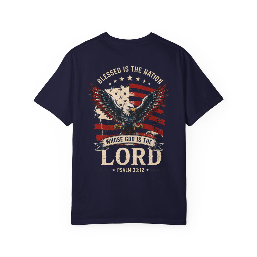 Navy Blessed Is the Nation Christian T-shirt back mockup with eagle, American flag, cream lettering, and Psalm 33:12.
