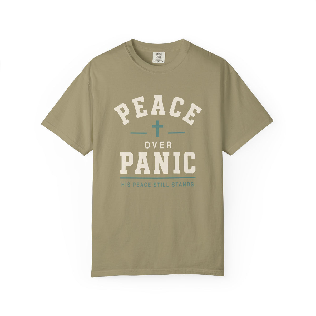 Tan Christian T-shirt featuring a “Peace Over Panic—His Peace Still Stands” design with a cross on a plain white background.