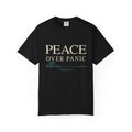 Black Christian T-shirt featuring a “Peace Over Panic” design with a wave and Philippians 4:6 on a plain white background.