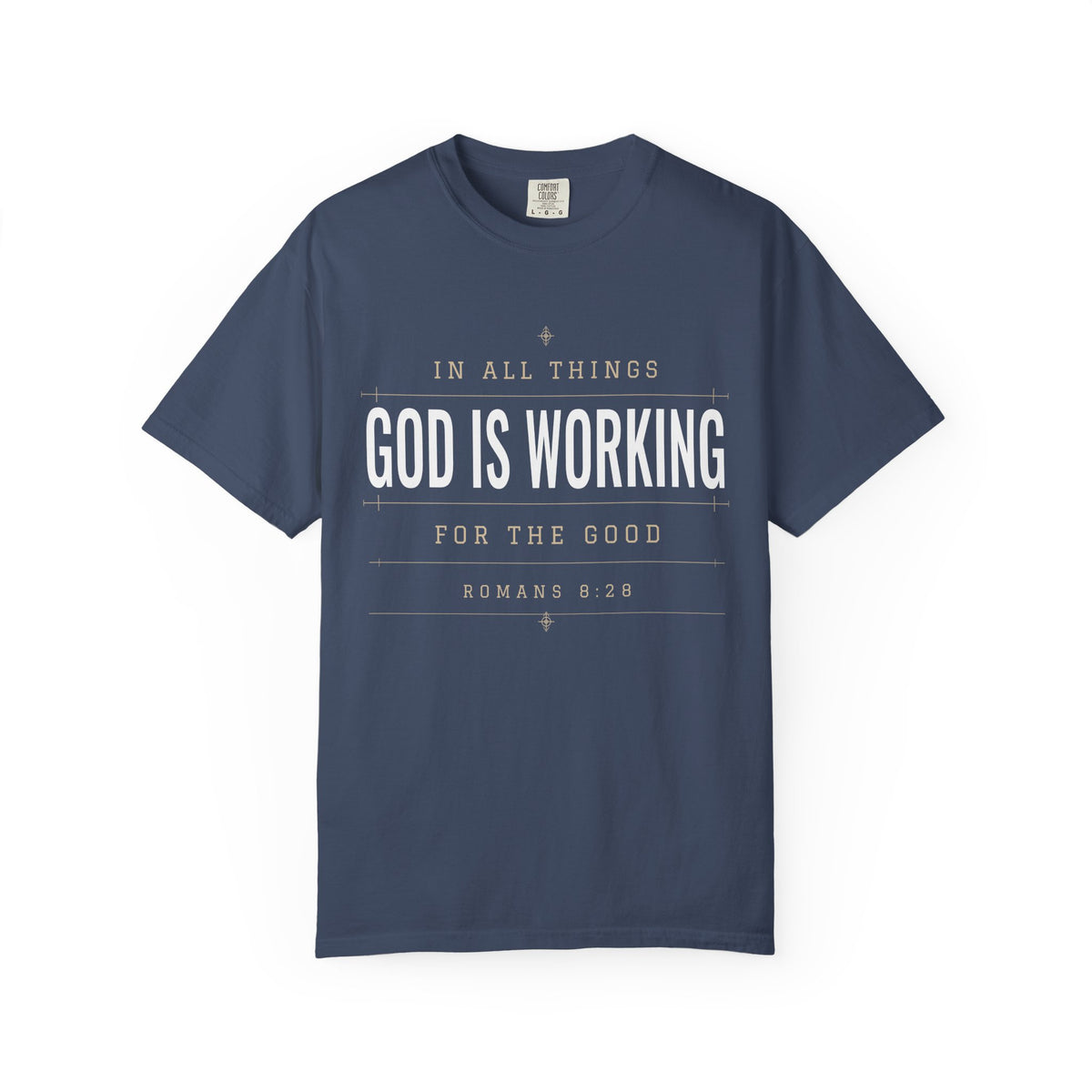 Light blue Christian T-shirt featuring “In All Things, God Is Working for the Good” with Romans 8:28 on a plain white background.