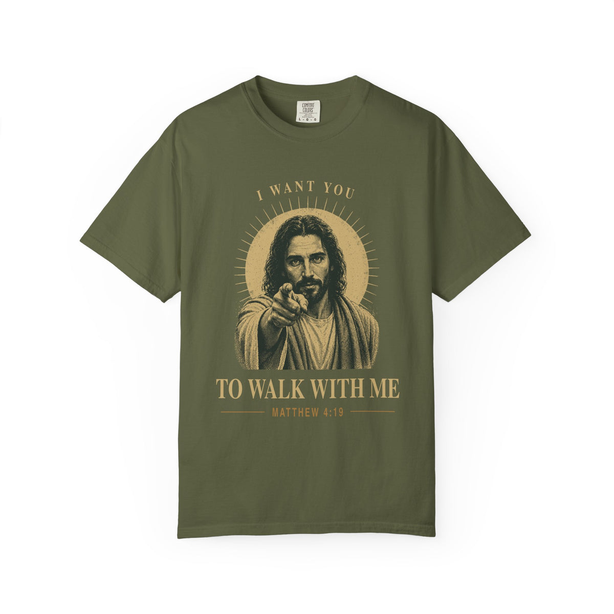 Olive green short-sleeve t-shirt with a graphic print of Jesus pointing, surrounded by a gold halo and the text 'I WANT YOU TO WALK WITH ME MATTHEW 4:19'.