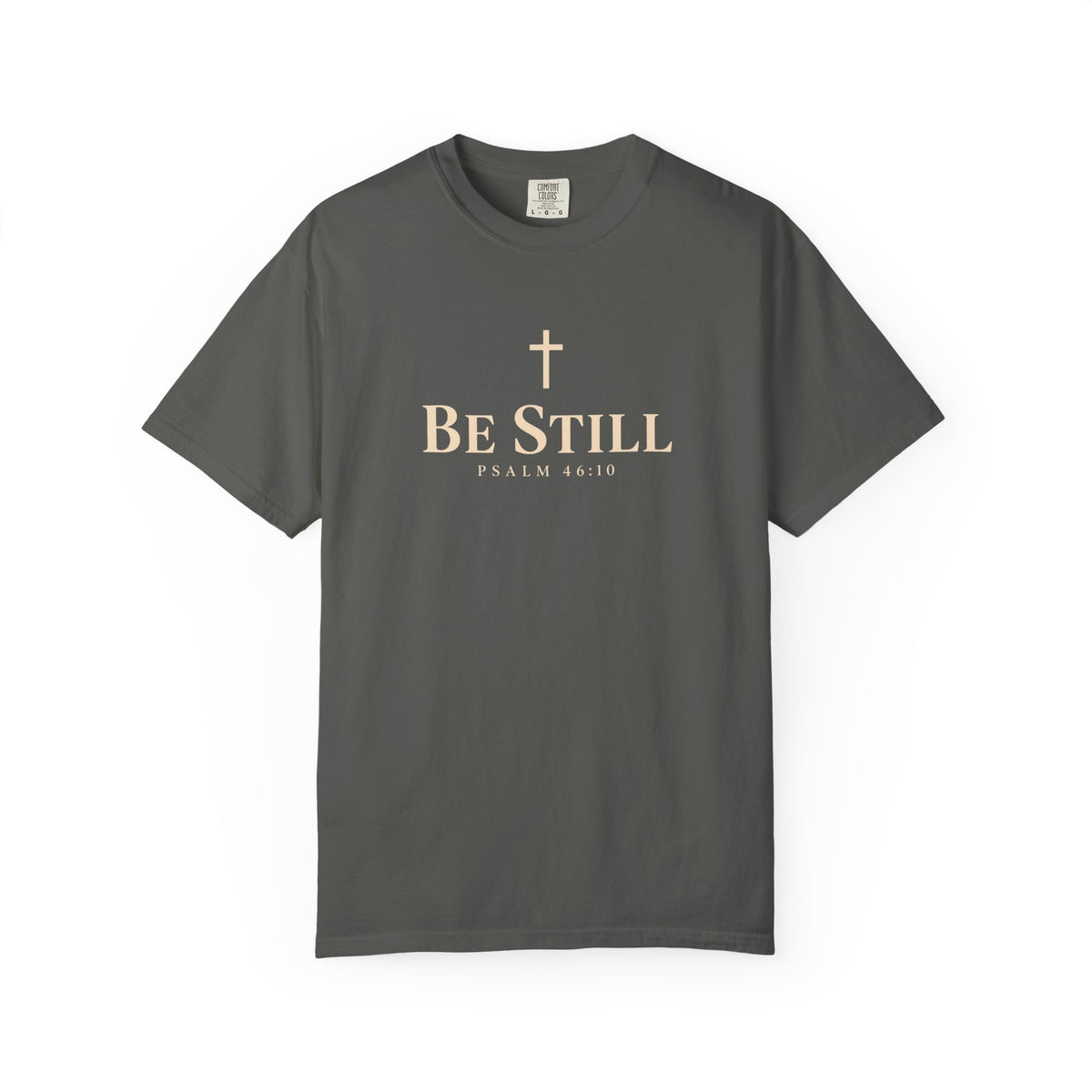 Dark gray Be Still Christian T-shirt featuring a cream cross, Be Still text, and Psalm 46:10 Scripture reference.