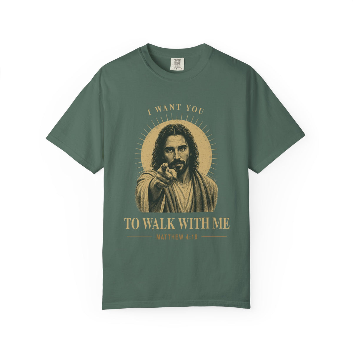 Light green short-sleeve t-shirt with a graphic print of Jesus pointing, surrounded by a gold halo and the text 'I WANT YOU TO WALK WITH ME MATTHEW 4:19'.