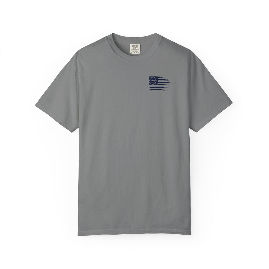 Gray crew-neck Christian T-shirt front mockup with small navy distressed 1776 American flag chest graphic.