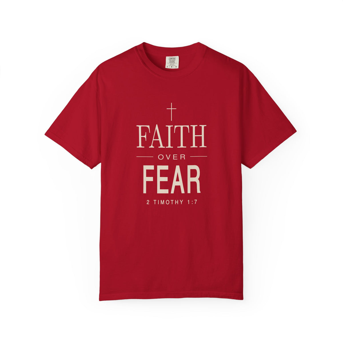 Red Christian T-shirt featuring a white “Faith Over Fear” design with a cross and 2 Timothy 1:7 on a plain white background.