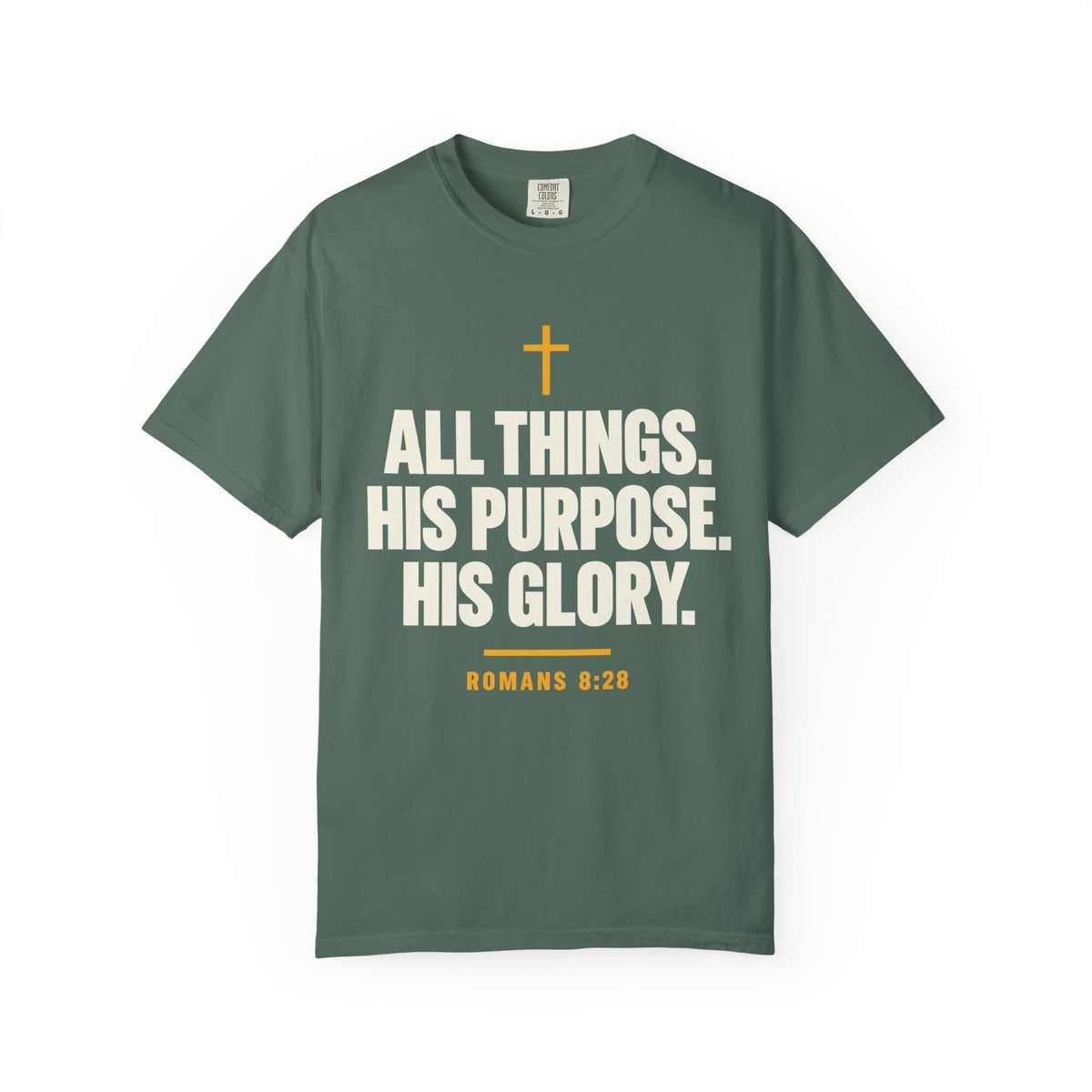 Light green Christian T-shirt featuring “All Things. His Purpose. His Glory.” with a cross and Romans 8:28 on a plain white background.