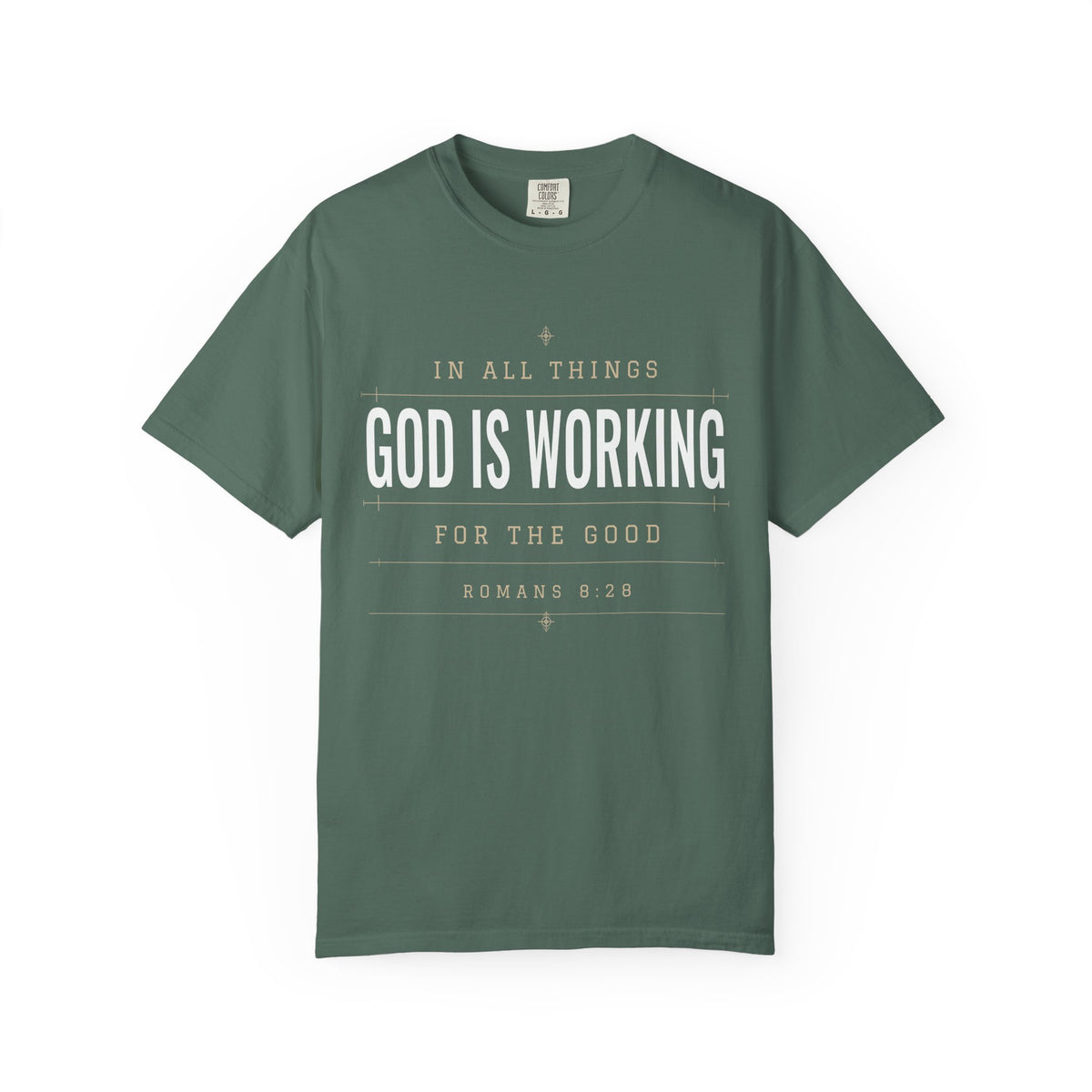 Olive green Christian T-shirt featuring “In All Things, God Is Working for the Good” with Romans 8:28 on a plain white background.