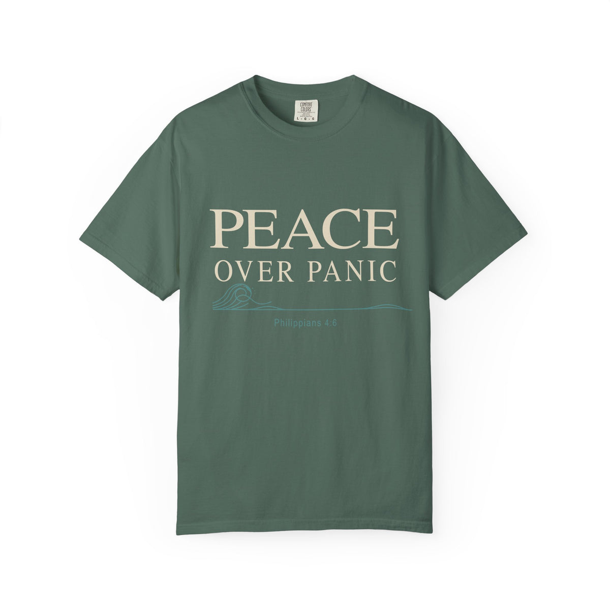 Light green Christian T-shirt featuring a “Peace Over Panic” design with a wave and Philippians 4:6 on a plain white background.