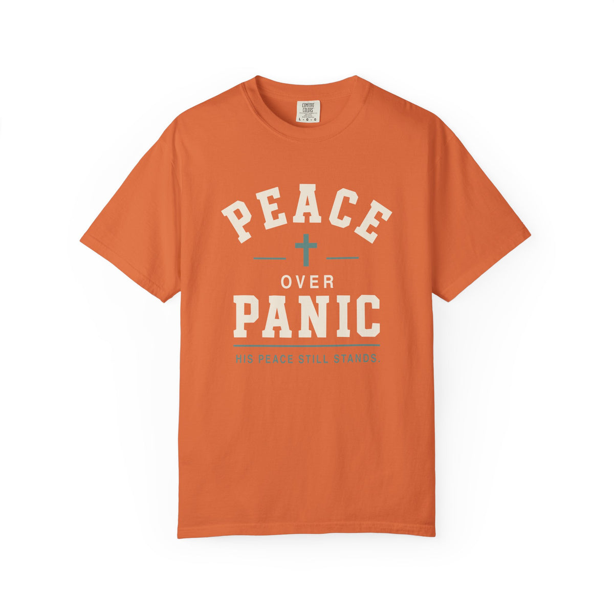 Orange Christian T-shirt featuring a “Peace Over Panic—His Peace Still Stands” design with a cross on a plain white background.