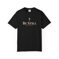 Black Be Still Christian T-shirt featuring a cream cross, Be Still text, and Psalm 46:10 Scripture reference.
