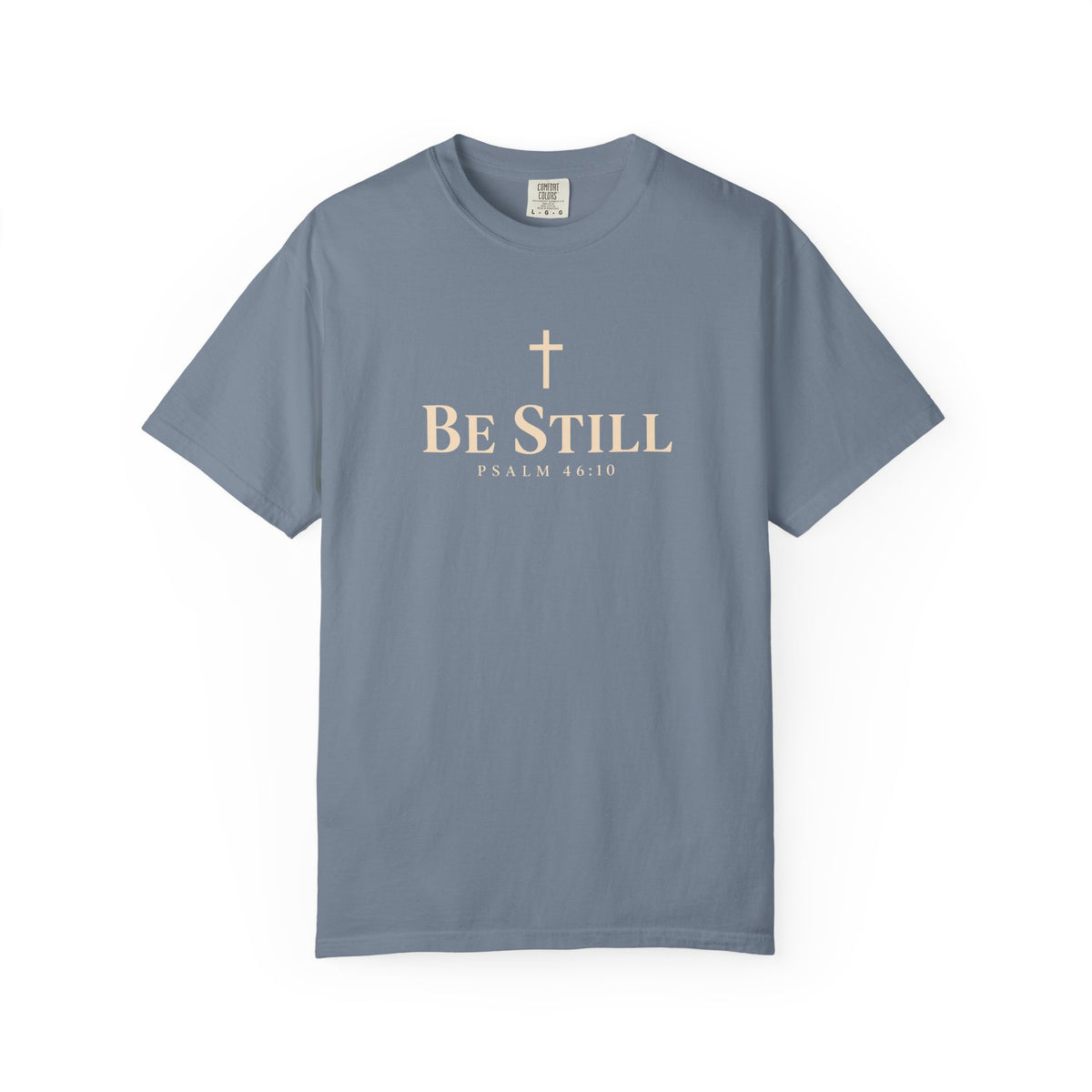 Blue jean Be Still Christian T-shirt featuring a cream cross, Be Still text, and Psalm 46:10 Scripture reference.