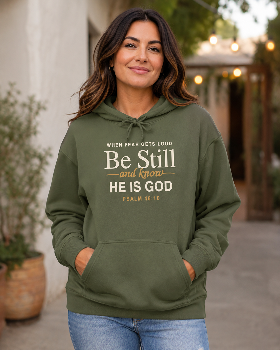 Woman wearing Be Still and Know Psalm 46:10 Christian hoodie