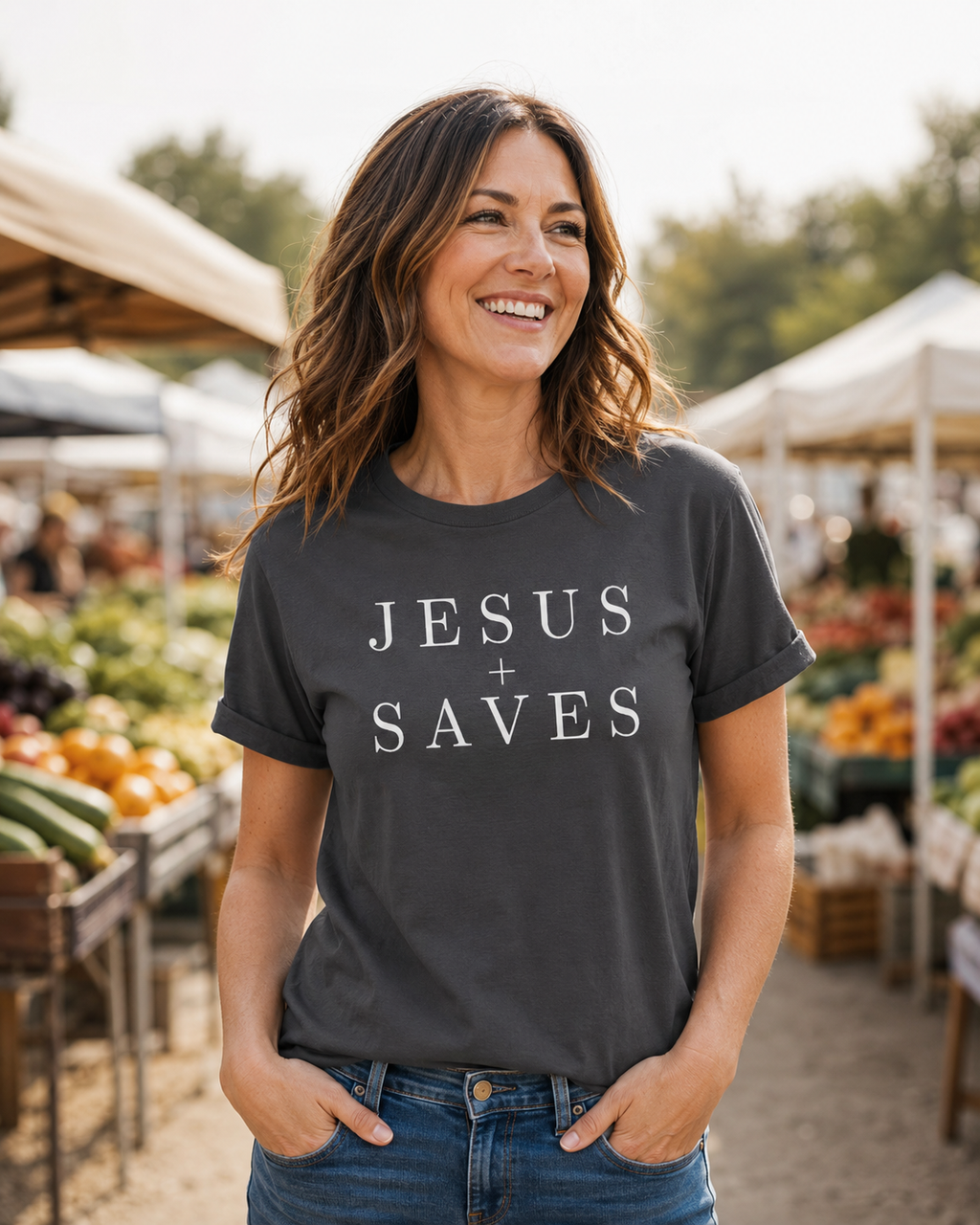 Woman wearing charcoal Jesus Saves Christian T-shirt at an outdoor market